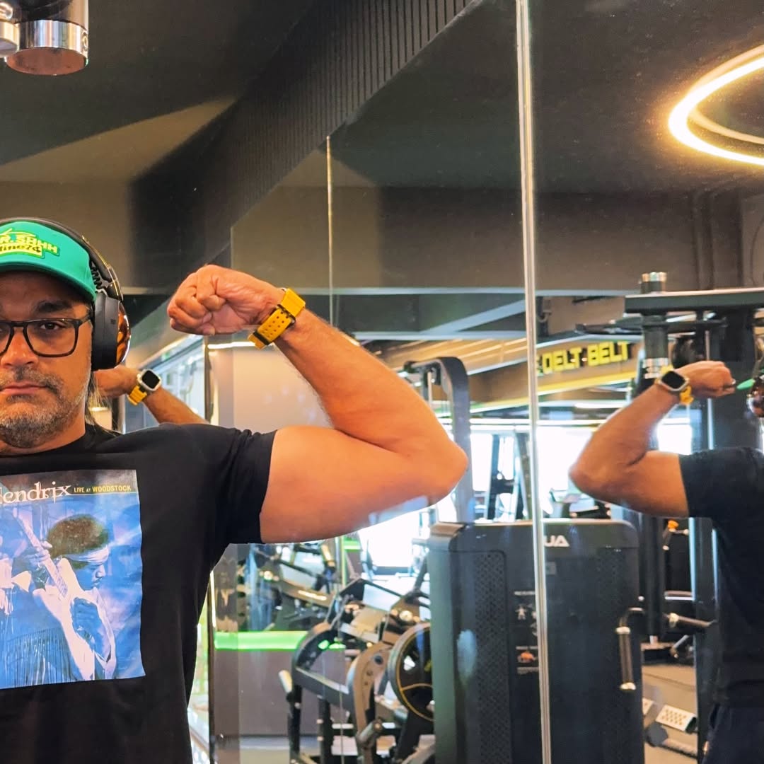 Girish documenting his fitness progress in the gym